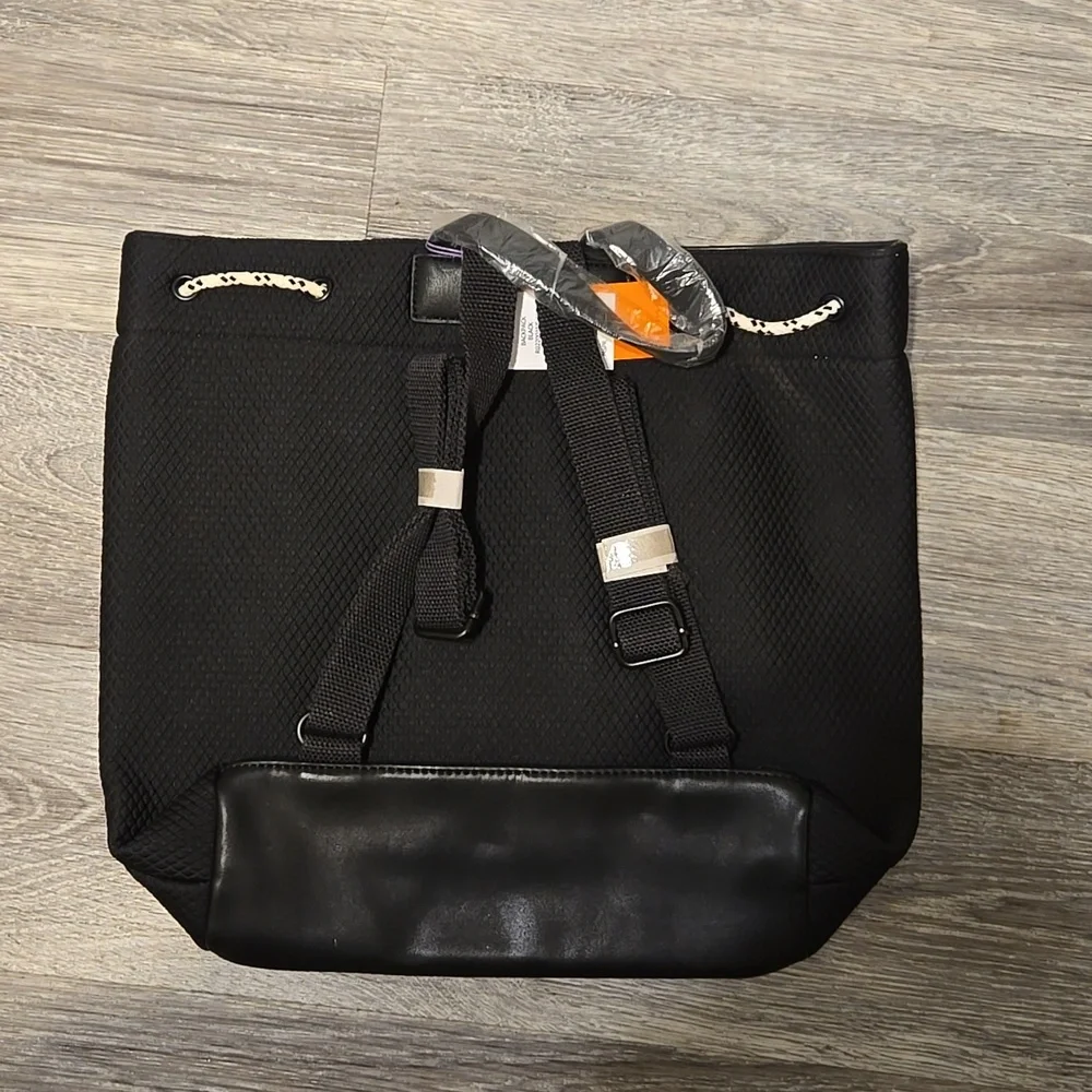 NWT Rocket Dog black backpack with zip top and striped lining.